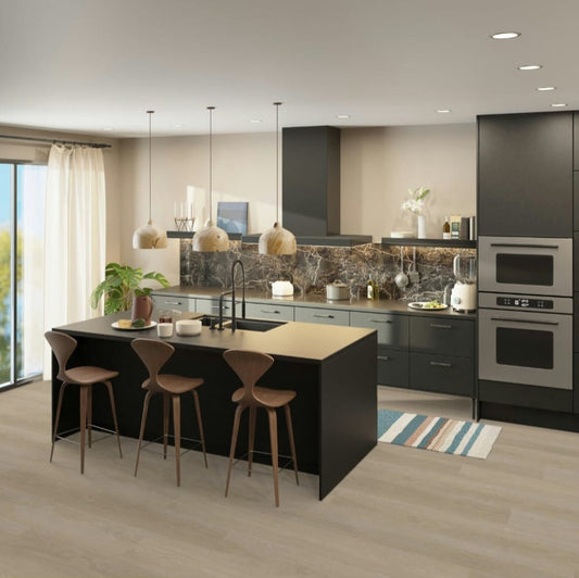 Modern kitchen with Balanced Oak flooring, featuring a kitchen island, bar stools, and stainless steel appliances.